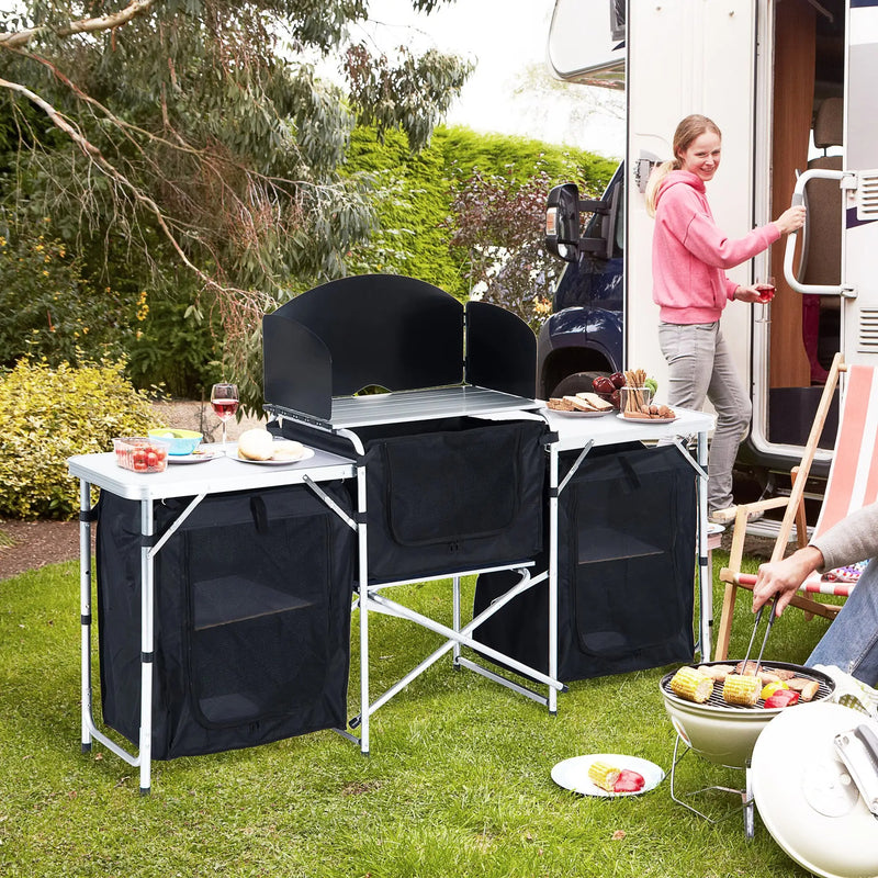 Outsunny Folding Camping Kitchen Table with Carrying Bag, Windscreen and 3 Enclosed Cupboards, Aluminum Cook Station, Black